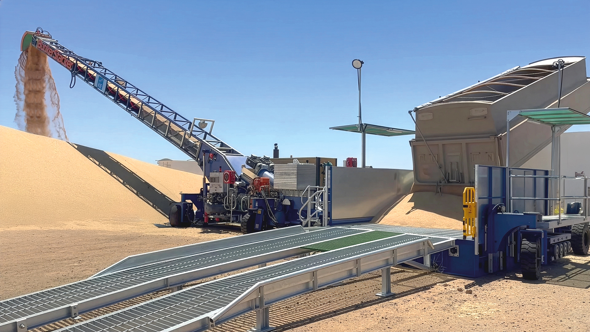 KE-Bunkerstacker4000-GrainCorp-v2 The BunkerStacker4000 is used to unload trucks during the grain harvest period and deposit their payload into open storage bunkers.